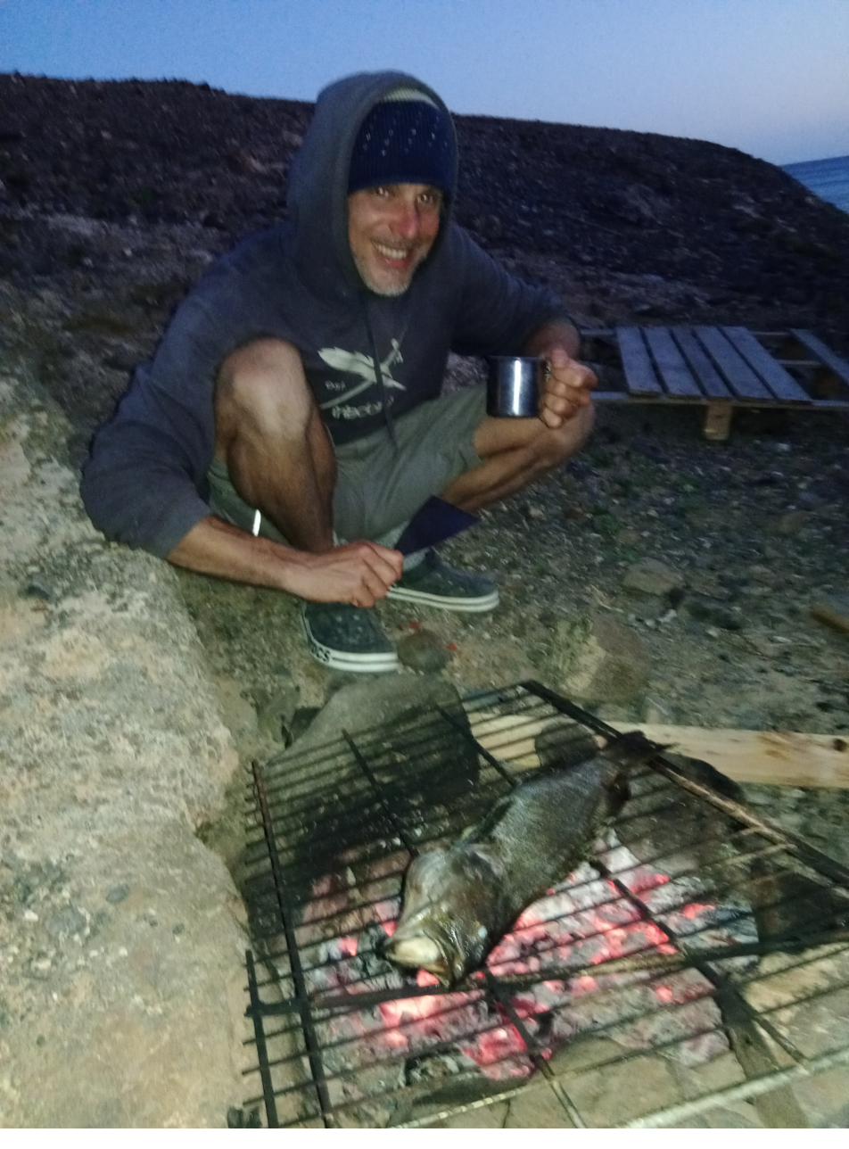 Campfire with fish at night